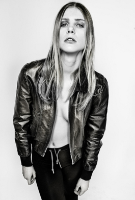Photography- Black & white.Blonde female model with black leather jacket 