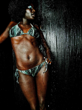 Photography. fashion editorial. model wearing green swimsuit. 