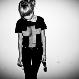 Photography. Fashion editorial. B&w photo.Lick My legs, black t-shirt. white screen printed cross 