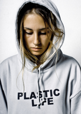 Photography. Close up. Portrait. Blonde model. Grey hoddy with Plastic gife printed on front 